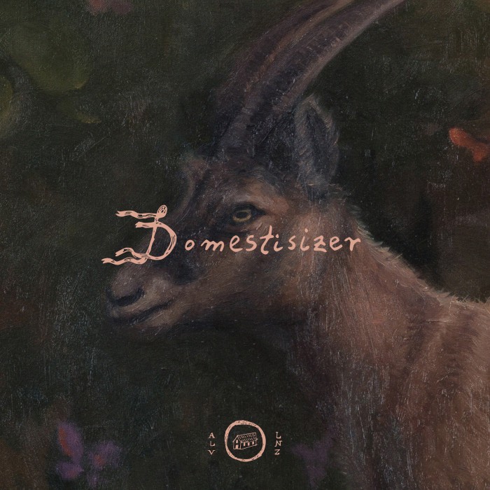 We see a female mountain goats head and in dursty rose letters the words Domestisizer written across its face. The D is stylized like flowing flags, below we see a little hosue ina. circle with the letters ALV to the left and LNZ to the right.