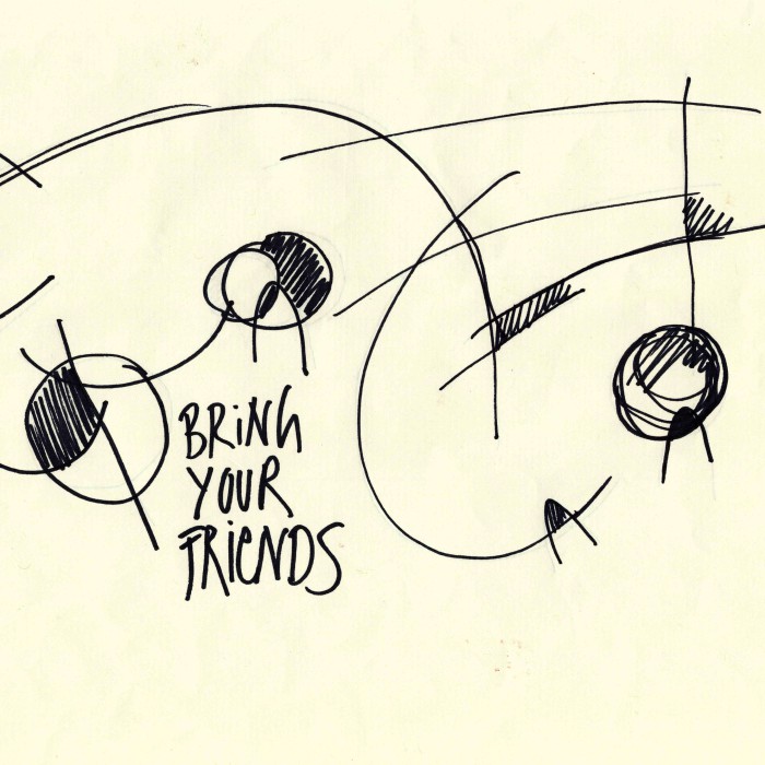 We see circles and lines criss crossing with black marker pen over a yellowish paper , where they cross the areas enclosed are colored in with the black marker,