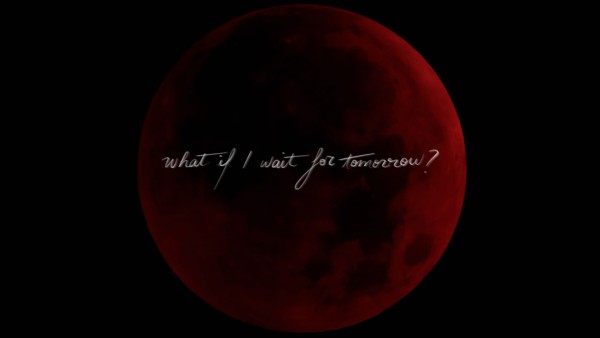 Full moon in a red tint on a black sky, in handwriting written acorss 'What If I wait for tomorrow?'